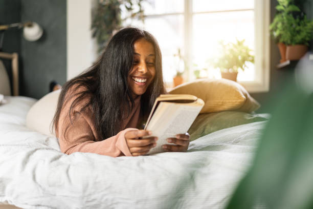 istock Reading a book in the bedroom 1341234448