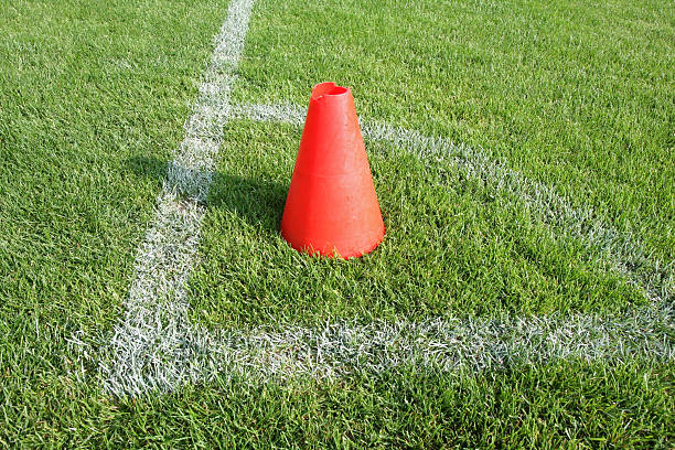 istock soccer field corner and red plastic traffic cone 134123450