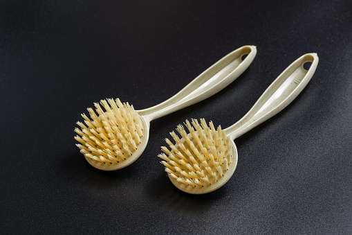 Hair brush isolated on black color background. Natural environmental protection brush
