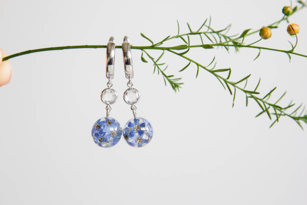 istock Real flowers in epoxy resin, jewelry 1341238924