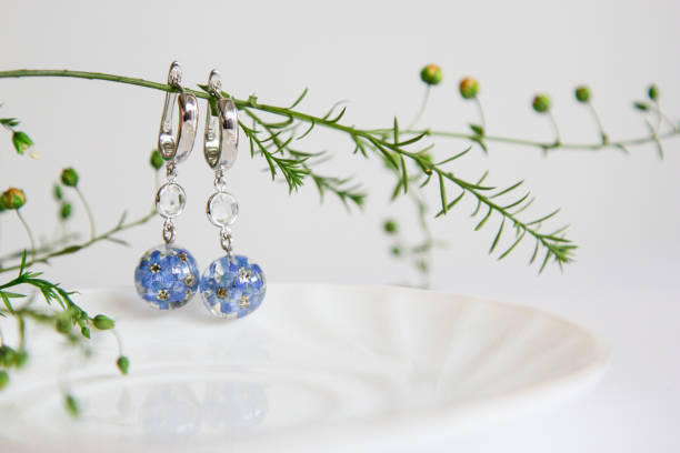 istock Real flowers in epoxy resin, jewelry 1341239095