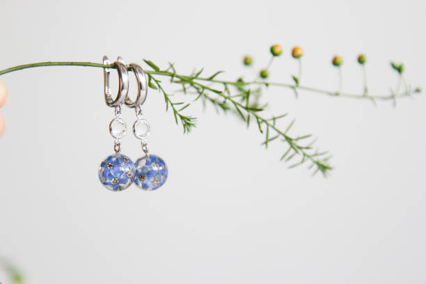 istock Real flowers in epoxy resin, jewelry 1341239205