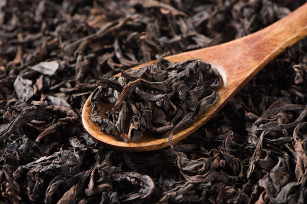 istock dry black tea leaf isolated on white background 1341239243