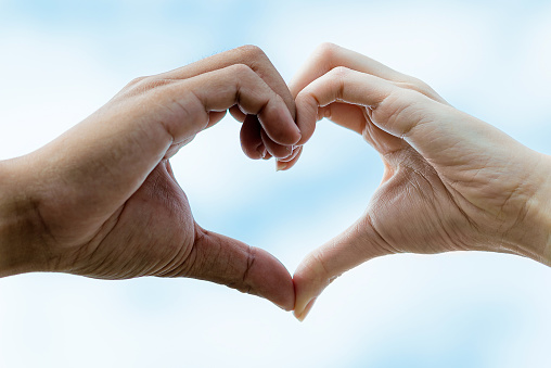 Couple hand showing heart shape