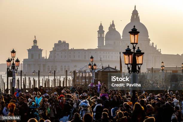 Crowd Of Tourists At The Carnival In St Marks Square In The Background The Basilica Of Santa Maria Della Salutevenice Italy Europe Stock Photo - Download Image Now