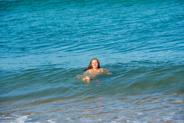 pretty young woman on vacation on a paradise beach