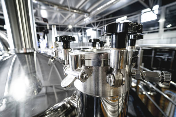 istock Craft beer brewing equipment in privat brewery 1341244781