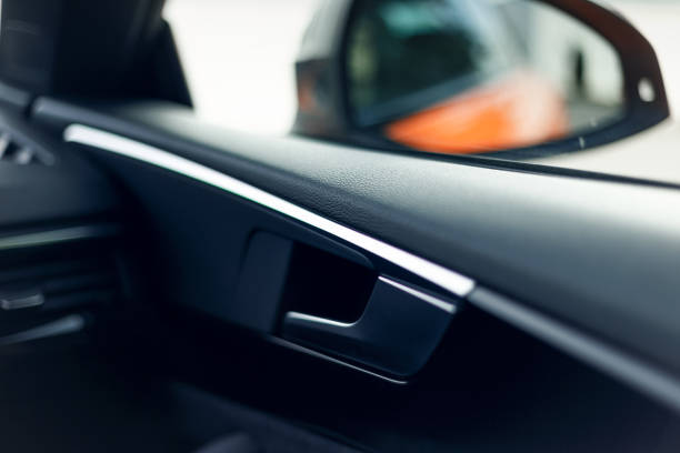 istock Car interior. Car door interior trim. Soft focus. Modern car illuminated dashboard. Luxurious instrument cluster. Close up shot of automobile instrument panel. Modern car interior dashboard 1341245517