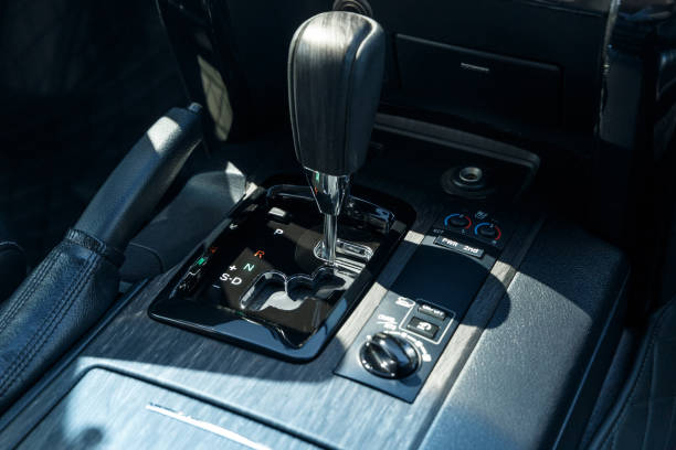istock Selector automatic transmission with leather in the interior of a modern expensive car. Black leather car interior. Luxurious car instrument cluster. Close up shot 1341245685