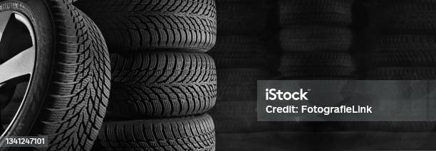 Tires In Car Workshop With Copy Space Stock Photo - Download Image Now - Tire - Vehicle Part, Winter, Warehouse
