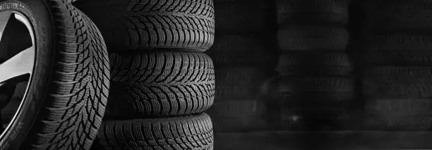 Photo of tires in car workshop with copy space