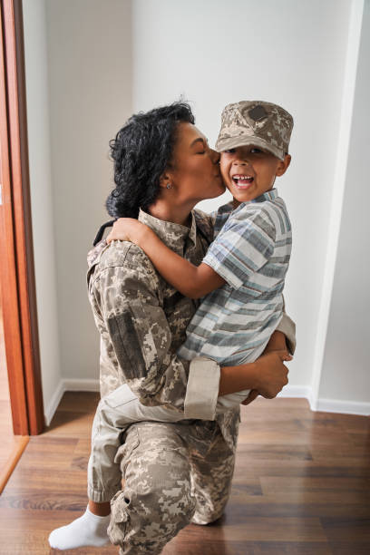 istock Mother and her son looking at each other and smiling while having fu 1341247217