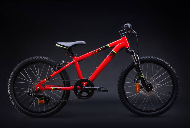 istock Sport mountain red bicycle isolated on black background 1341247924
