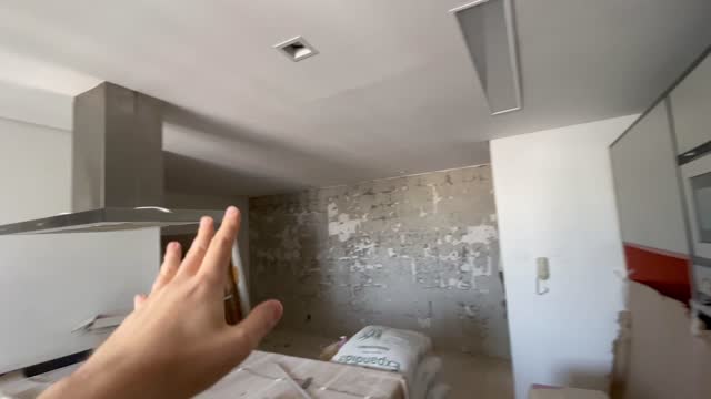 POV of person showing kitchen during apartment restoration