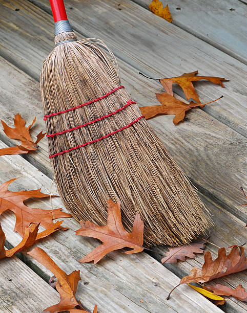 Broom And Fallen Leafs stock photo