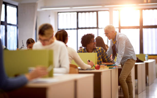 istock Female professor and a student talking about a lesson 1341249234