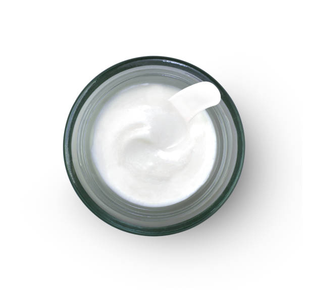 istock Cosmetic cream in glass jar isolated on white 1341250374