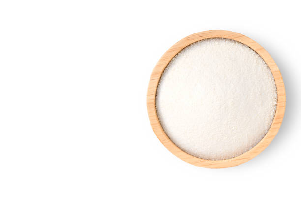 Collagen powder in wooden bowl isolated on white background. Collagen powder in wooden bowl isolated on white background. Top view. Copy space. Clipping path. amino acid photos stock pictures, royalty-free photos & images