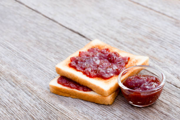 istock Toast sliced bread with red strawberry jam 1341250522