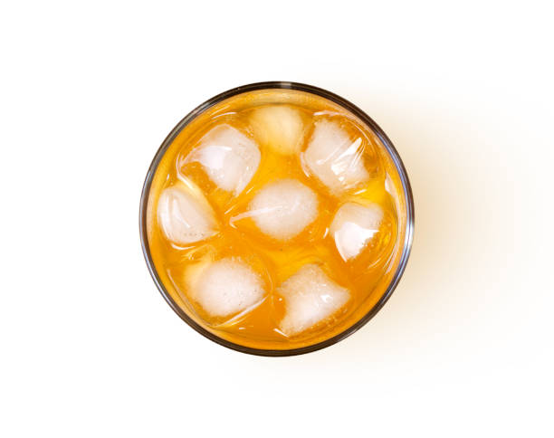 istock Orange juice with ice cubes in glass isolated on white 1341250539