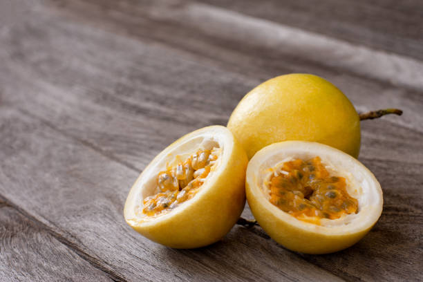 istock Yellow Passion fruit on wooden table background. 1341250599