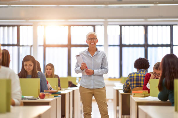 istock Female professor and students at the lecture 1341251498
