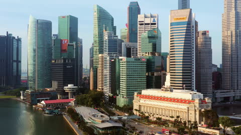 Skyscraper tower buildings in financial business district at Marina bay Singapore city center, drone aerial cityscape view. Asia travel destination, Singapore landmark, or modern architecture concept
