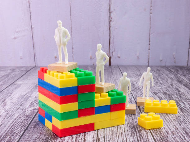 istock business figure and puzzle block multicolour  for strategy concept 1341255674