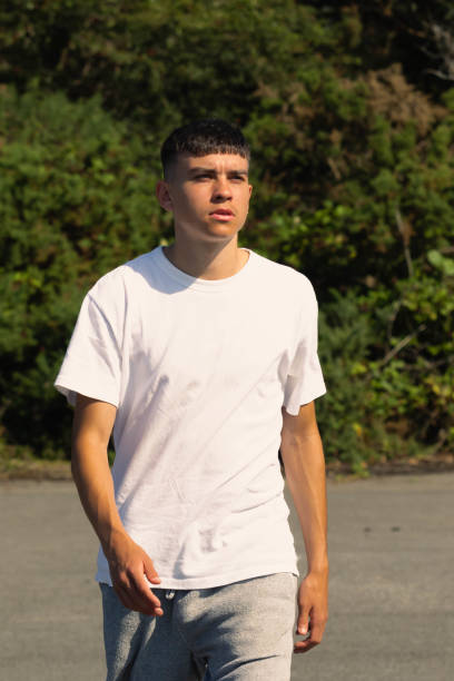 istock 18 year old walking outdoors on a summer day 1341255699