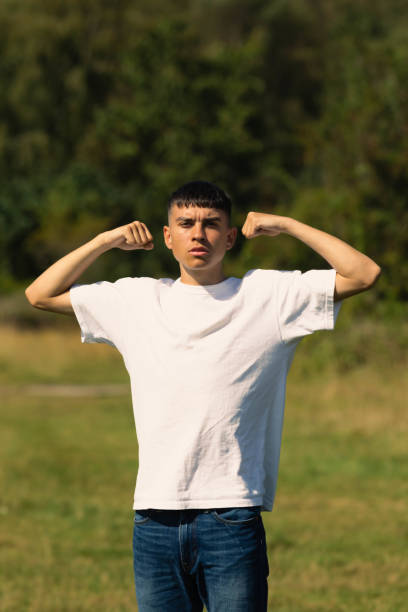 istock 18 year old walking outdoors on a summer day 1341256468
