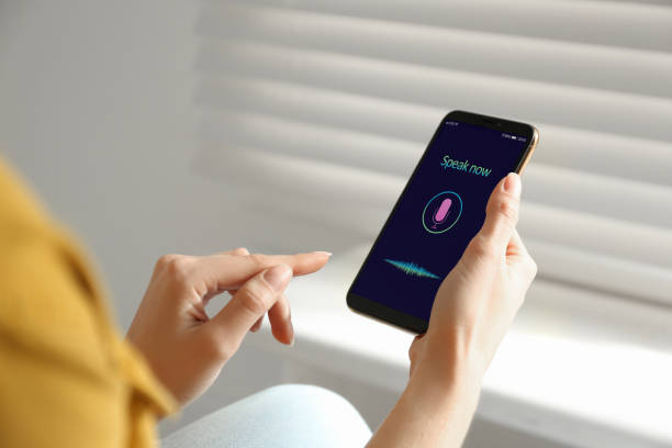 istock Woman using voice search on smartphone indoors, closeup 1341257576