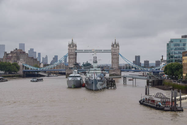 London, United Kingdom - August 30 2021: Tower Bridge, HMS Belfast and River Thames on an overcast day