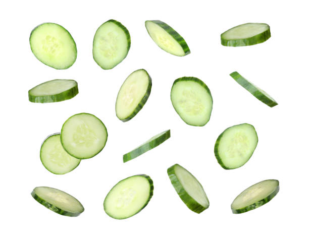istock Set of flying fresh cucumber slices on white background 1341258012