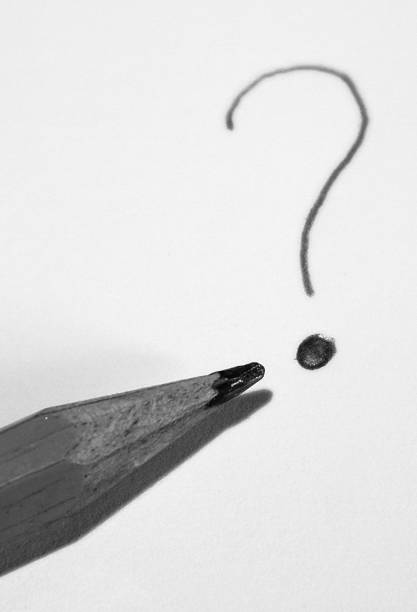 istock Black And White Photography Pencil on paper with Question Mark 1341258725