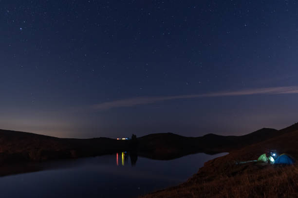 istock The starry sky at night on the grassland 1341260190