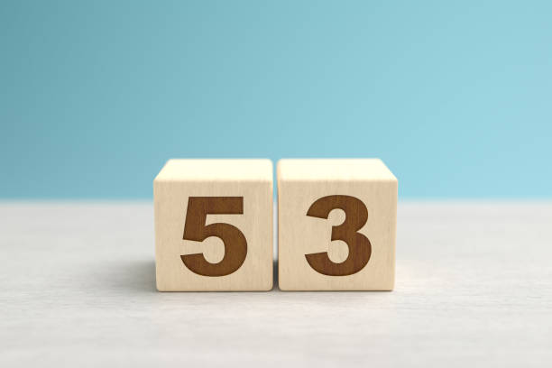 istock Wooden toy blocks forming the number 53. 1341261596