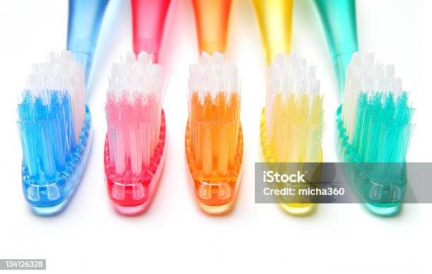 Multicolored Toothbrushes Stock Photo - Download Image Now - Dentist, Rainbow, Orange Color