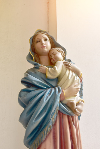 Closeup of Statue of Our lady virgin Mary with Child Jesus in catholic church, Thailand. selective focus.
