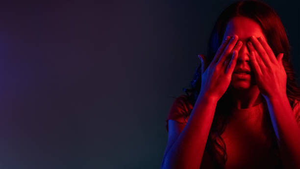 istock scared woman anxiety problem banner woman neon 1341266391