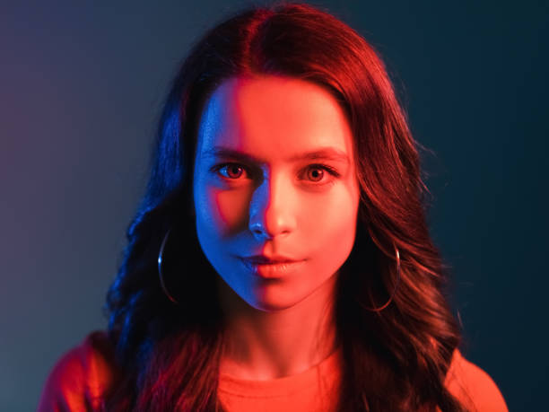 istock neon light people retro wave portrait woman red 1341266392