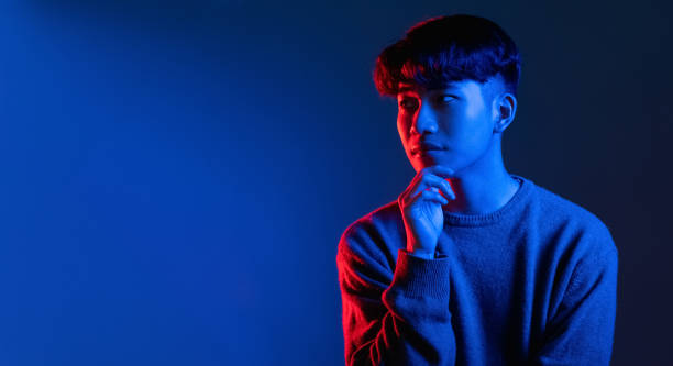 istock thoughtful man idea banner bright blue neon light 1341266394