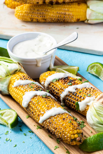 istock Grilled Whole Corn Cob Served with Salt, Coriander and Garlic Sauce 1341266993