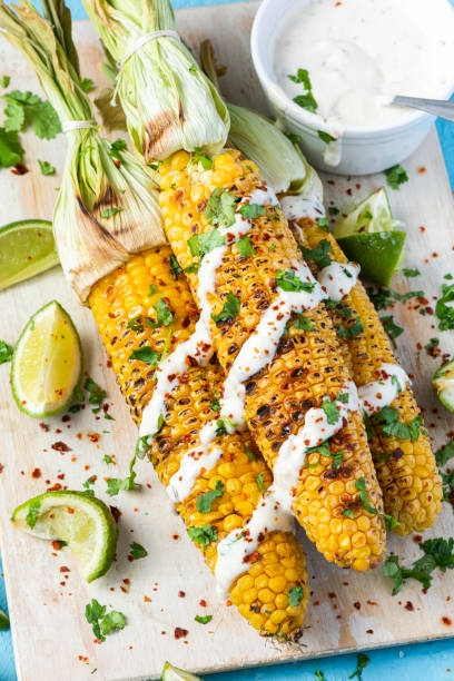 istock Grilled Whole Corn Cob Served with Salt, Coriander and Garlic Sauce 1341267075