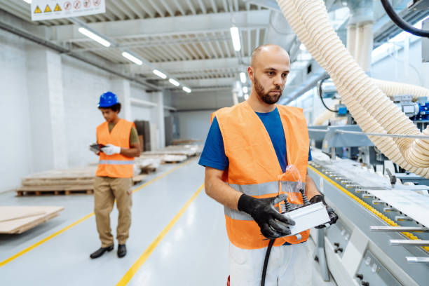 istock Machinist controlling the process in the factory 1341267566