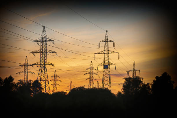 istock Line of high voltage wires during scenic sunset 1341269223