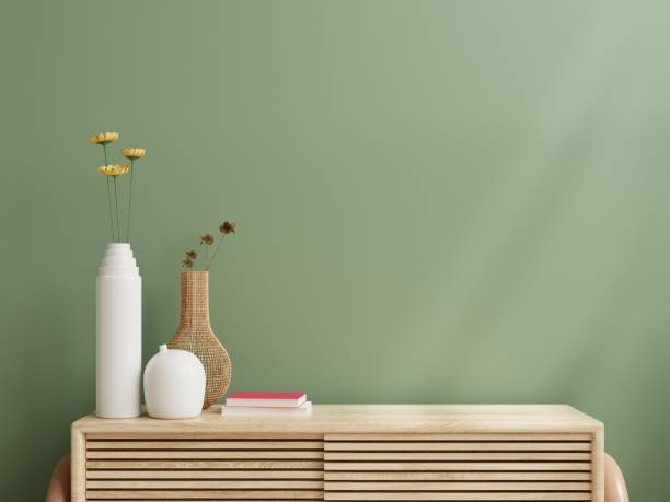 istock Interior wall mockup,Green wall and wooden cabinet. 1341271247