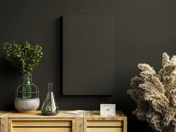 istock Mockup black frame on cabinet in living room interior on empty dark wall. 1341271347