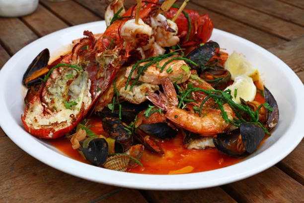 istock Grilled seafood platter on wooden table 1341271350