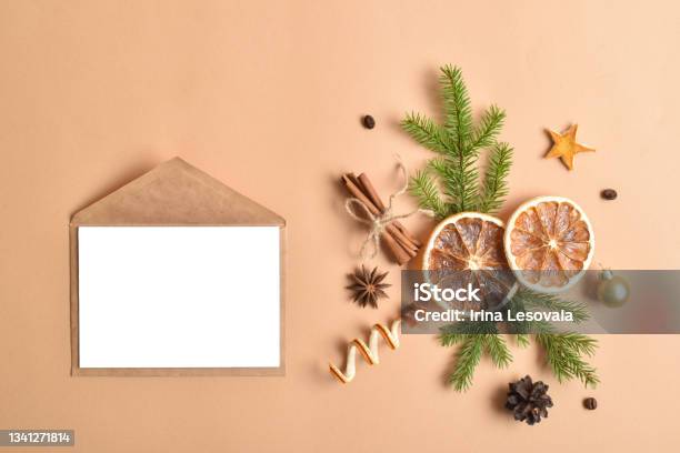 The Christmas Decor Is Laid Out On A Beige Background Flat Lay Minimalistic Christmas Card Stock Photo - Download Image Now