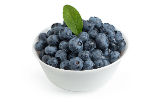 istock Blueberries in bowl isolated on white background 1341273688